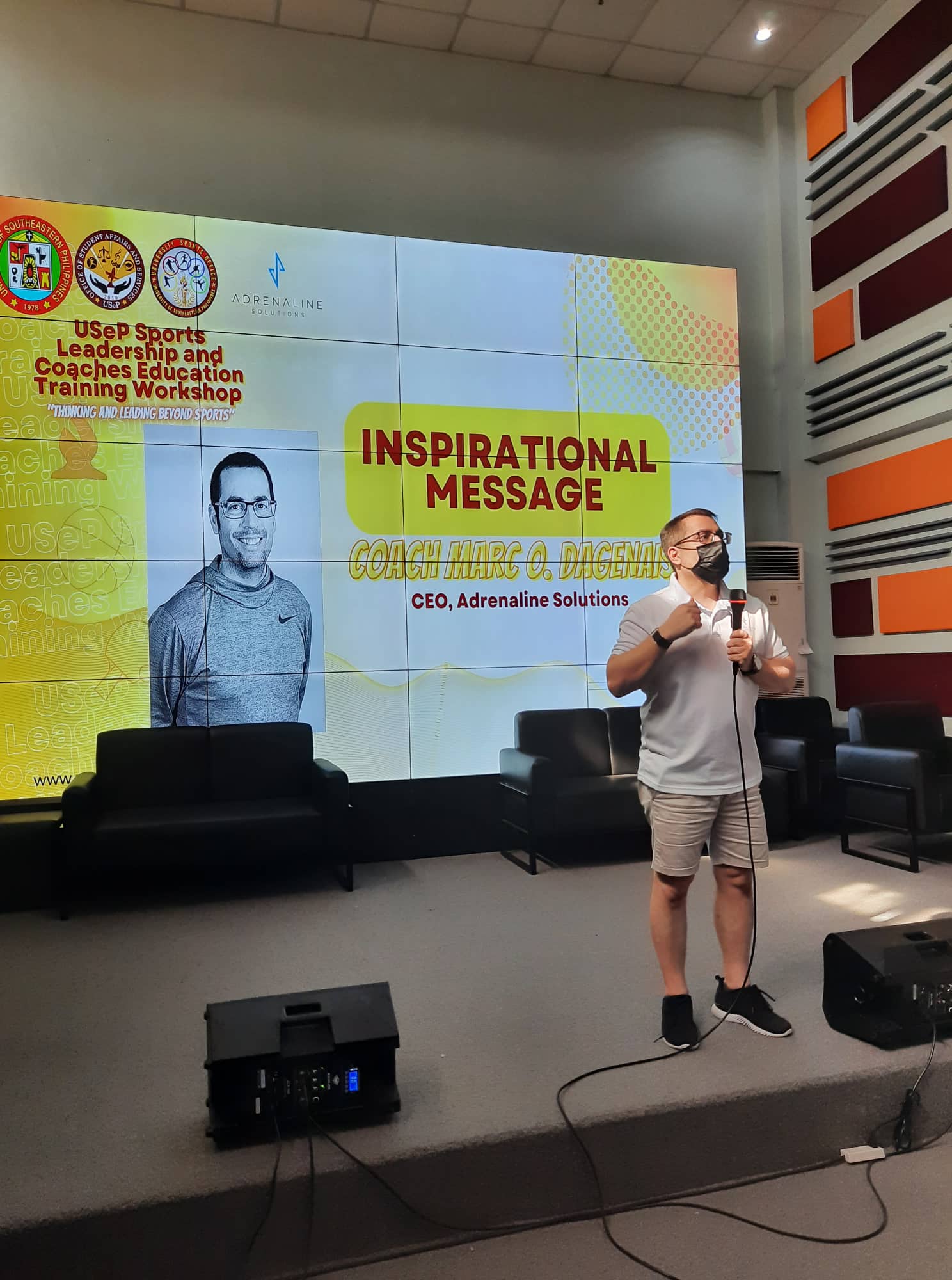 Coach Marc onstage at the University of Southeastern Philippines Sports Leadership and Coaches Education Training Workshop